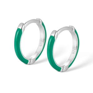 Detailed macro view of S925 sterling silver stamp and green enamel on small hoop earrings