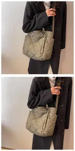 Close-up of olive green quilted tote bag with diamond stitching and nylon fabric