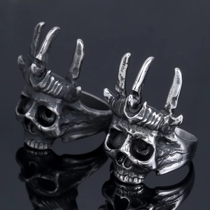 Vintage silver punk crown skull ring with gothic distressed finish on black mirror