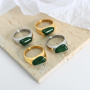 Minimalist irregular stainless steel ring with green oval inlay in gold and silver finish