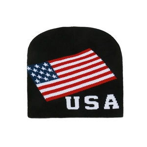 Winter black knit beanie featuring USA flag pattern and white lettering in flat lay