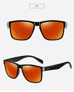 Detail view of polarized sunglasses with black frame and orange reflective lenses