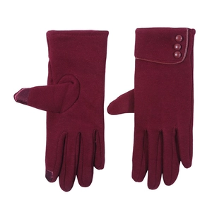 Close-up of wine red winter gloves with touchscreen fingertips and elegant triple button detail