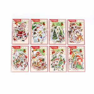 8-pack vintage Christmas gold foil stickers featuring Santa, reindeer, and retro illustrations