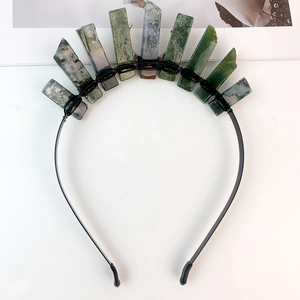 Detailed close-up of natural moss agate stones hand-wired on a black metal headband