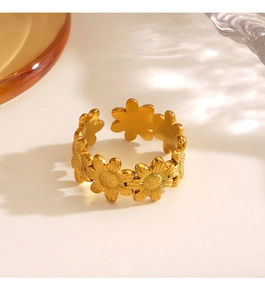 Detail of adjustable gold sunflower ring with intricate petal texture and metallic finish
