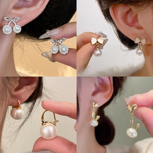Detail shots of elegant pearl earrings in heart, rabbit, and bowknot designs
