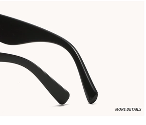 Detailed close-up of glossy black sunglasses temples with smooth curved ends and macro finish