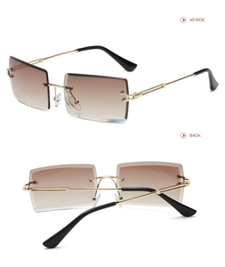 Detail view of rimless square sunglasses with brown gradient lenses and gold metal temples