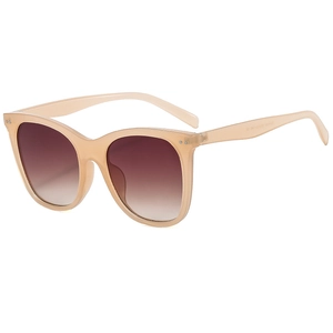 Retro cat eye sunglasses with translucent beige frames and brown gradient lenses