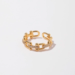 Detail of gold U-shaped link ring with micro-pave cubic zirconia accents