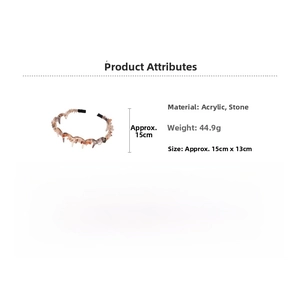 Detail view of acrylic hairband with brown gravel stones and inner teeth grip