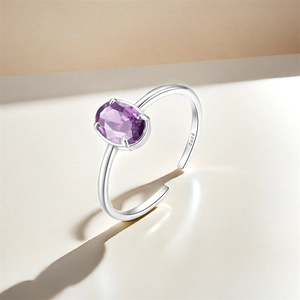 Detail of S925 sterling silver ring with oval purple zircon and hallmark engraving