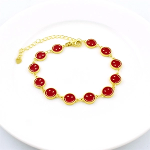 Gold plated bracelet with red enamel smiley face charm and adjustable lobster clasp