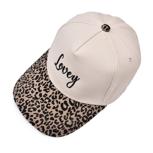 Detailed embroidery of Lovey text on beige 5-panel hat with leopard print brim