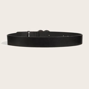 Trendy black punk leather belt with stud details and classic buckle on cream background