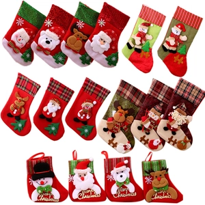16 varied Christmas stocking ornaments with festive Santa and reindeer characters