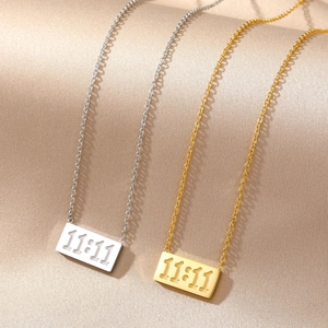 Minimalist 11:11 square plate necklaces in gold and silver steel on satin fabric