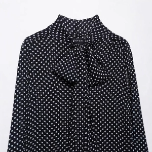 Women's black polka dot chiffon cape blouse with high neck tie-up bow detailing