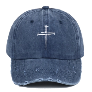 Navy blue washed cotton baseball cap with white cross embroidery and distressed brim