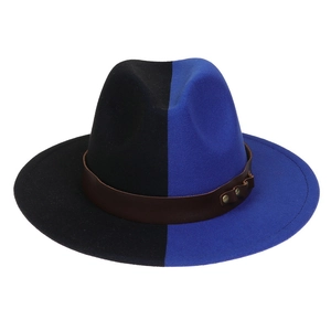 Close-up of a two-tone blue and black wide brim fedora hat with a brown leather belt