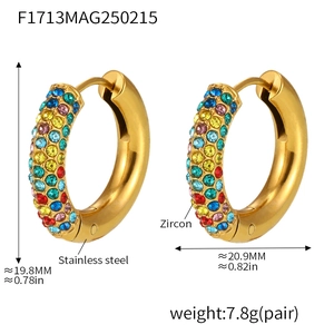 Macro detail of 4mm gold-plated hoop earrings with multi-color zircon stones and click closure