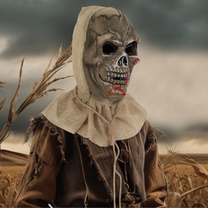 Creepy Halloween scarecrow skeleton mask with hood in a dark cornfield setting