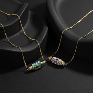 Vintage gold necklaces with blue and pink enamel hexagonal column pendants