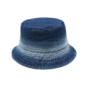 Faded blue denim bucket hat with gradient wash and reinforced stitching on white background