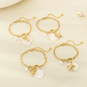 Golden titanium steel beach bracelet set with seashell, pearl, and sea animal pendants