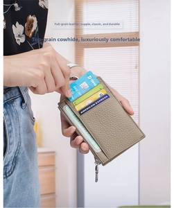 Close-up of khaki pebbled leather wallet showing card slots and premium texture