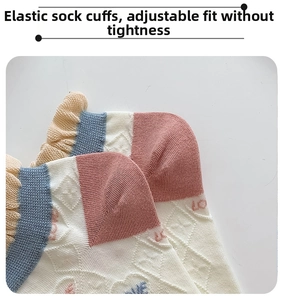 Detail of diamond pattern knit cotton socks with elastic frill cuff and color contrast