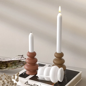 Detail of DIY silicone mold and stacked geometric candle holders in a minimalist setting