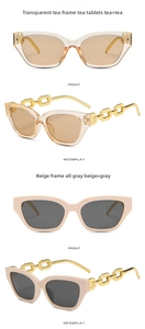 Detail view of cat eye sunglasses with gold chain temples in tea and beige colors