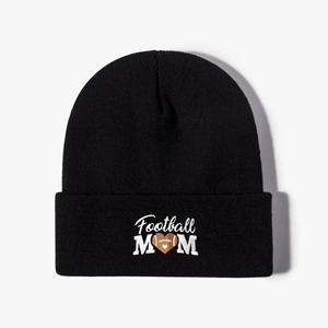 Black knit beanie featuring white Football MOM embroidery with a heart shaped football