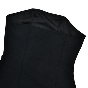 Detailed close-up of the black bandeau neckline and premium stitching on the dress