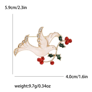 White enamel dove brooch with rhinestones and size labels, 5.9cm by 4.0cm, weighing 9.7g