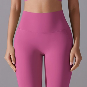 Close-up of high-waist magenta yoga pants showing seamless fit and premium elastic fabric