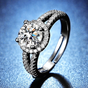 Detail shot of round brilliant cut moissanite ring with halo and double row band