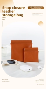 Detail of orange PU leather pouches with snap closure for jewelry and earphones
