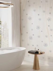 Detailed view of white snowflake wall decals applied to a modern bathroom interior wall
