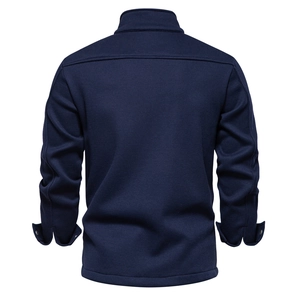 Detail view of the back of a navy men's fleece-lined waffle knit jacket with stitching