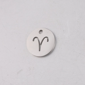 Macro view of 12mm silver stainless steel Aries zodiac pendant with hollowed circular design