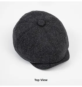 Top view showing the classic eight-panel stitching and texture of grey wool newsboy cap