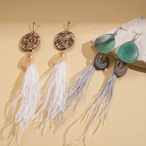 Ethnic style long feather earrings with resin beads and alloy hooks in a warm sunlight setting
