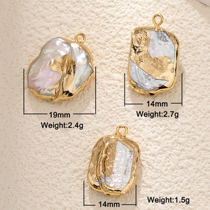 Close-up of Baroque irregular freshwater pearls with gold plating and shell inlay details