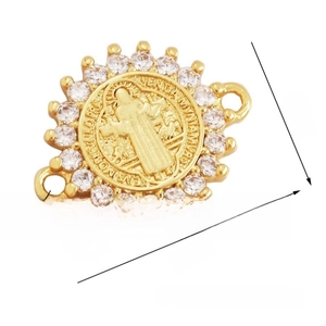 Detail of gold-plated Saint Benedict medal connector with white cubic zirconia inlay