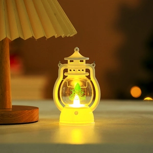 Detail of white Christmas LED lantern with warm yellow light and Merry Christmas print