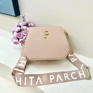Pink lychee leather tote bag with golden P ornament and branded wide shoulder strap