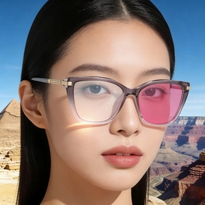 Detail of square polarized sunglasses with gradient gray frame and golden metal hinge design
